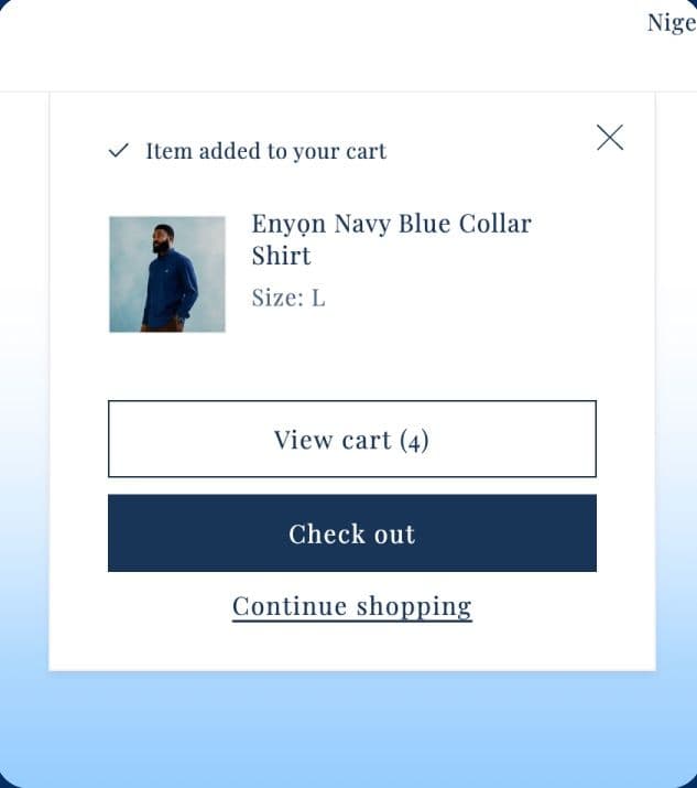 Enyọn’s added-to-cart pop-up for a Navy Blue Collar Shirt